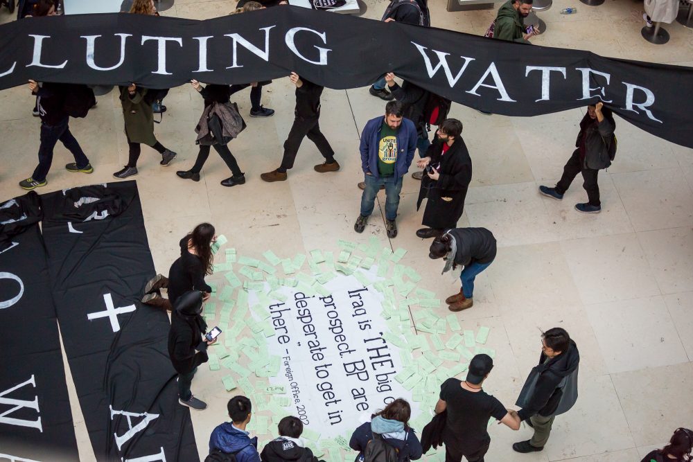 Messages from the public to the British Musuem are scattered around the Foreign Office quote (2002), whilst protestors file out with of the museum with the 'living tapestry'.