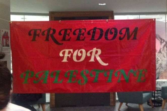 Banner that reads "Freedom for Palestine" in the colours of the Palestinian flag.