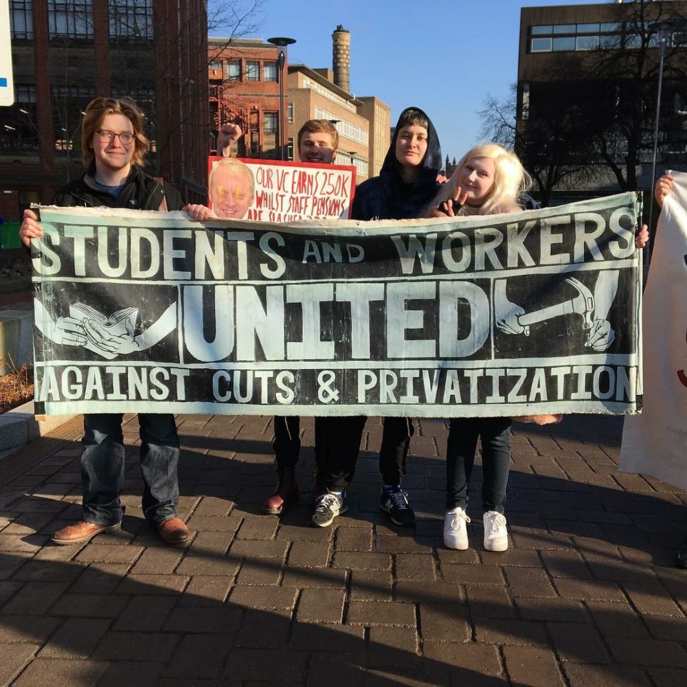 Newcastle University students hold banners at picket line in solidarity with staff