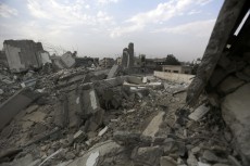 Picture of a destroyed urban area, rubble everywhere